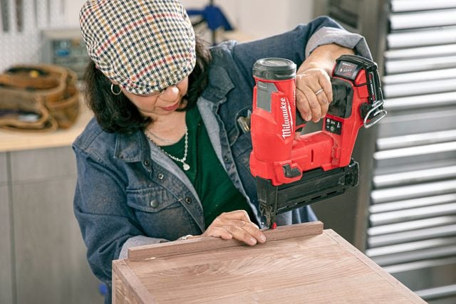 album ledger being installed at the bottom of the front panel