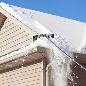 roof rake pulling snow from roof